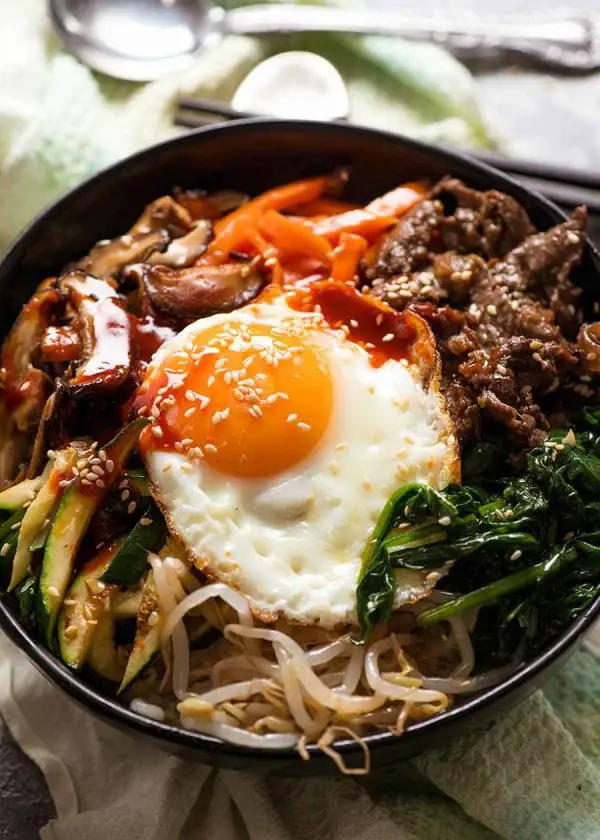 Close up of Bibimbap Korean Rice Bowl with Bibimbap Sauce, ready to be eaten