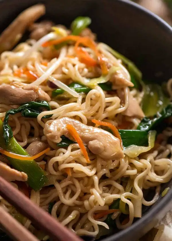 Close up of Chow Mein Ramen Noodles in a rustic black bowl, ready to be eaten