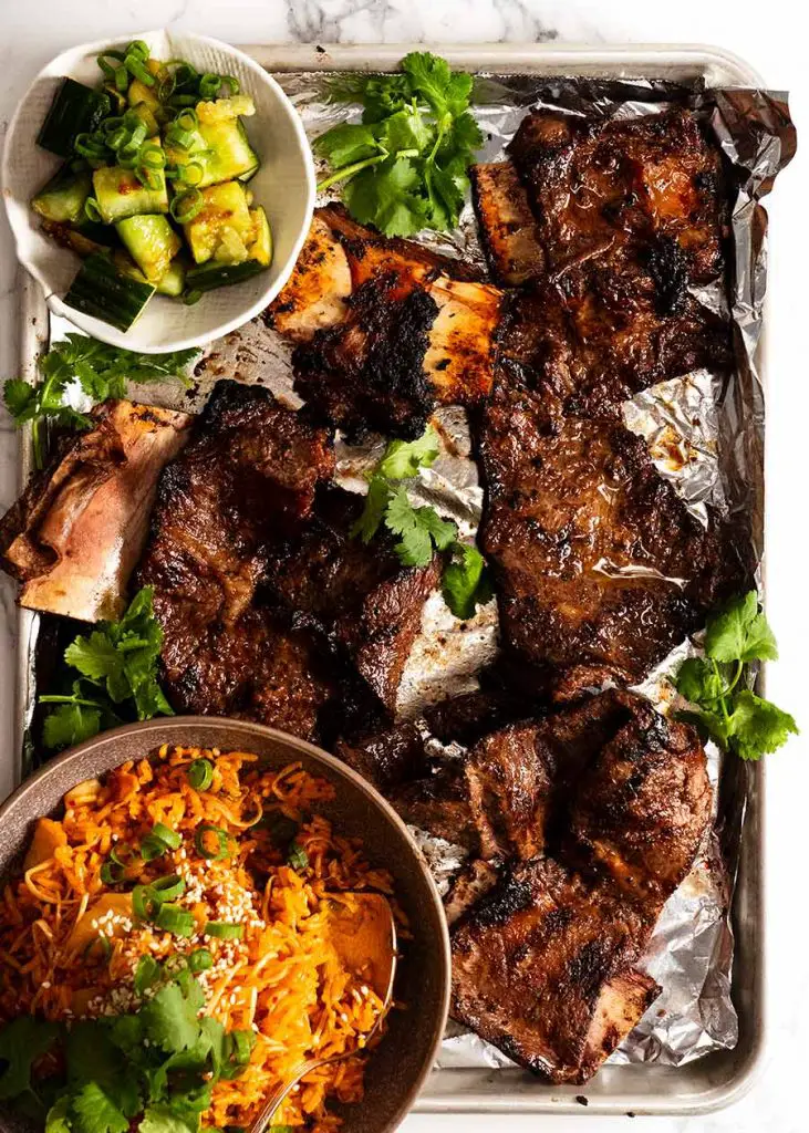 Overhead photo of tray with freshly cooked Korean BBQ Marinated Beef Short ribs (Galbi)