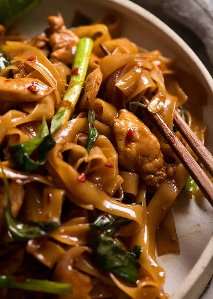 Close up of Thai Drunken Noodles with chopsticks