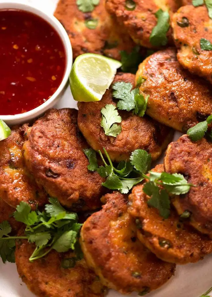 Close up photo of Thai Fish Cakes on a plate, ready to be eaten